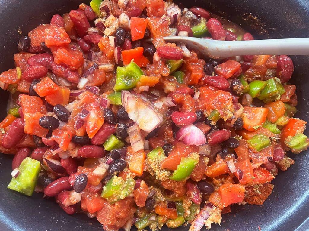 Mixing the ingredients in a slow cooker crock.