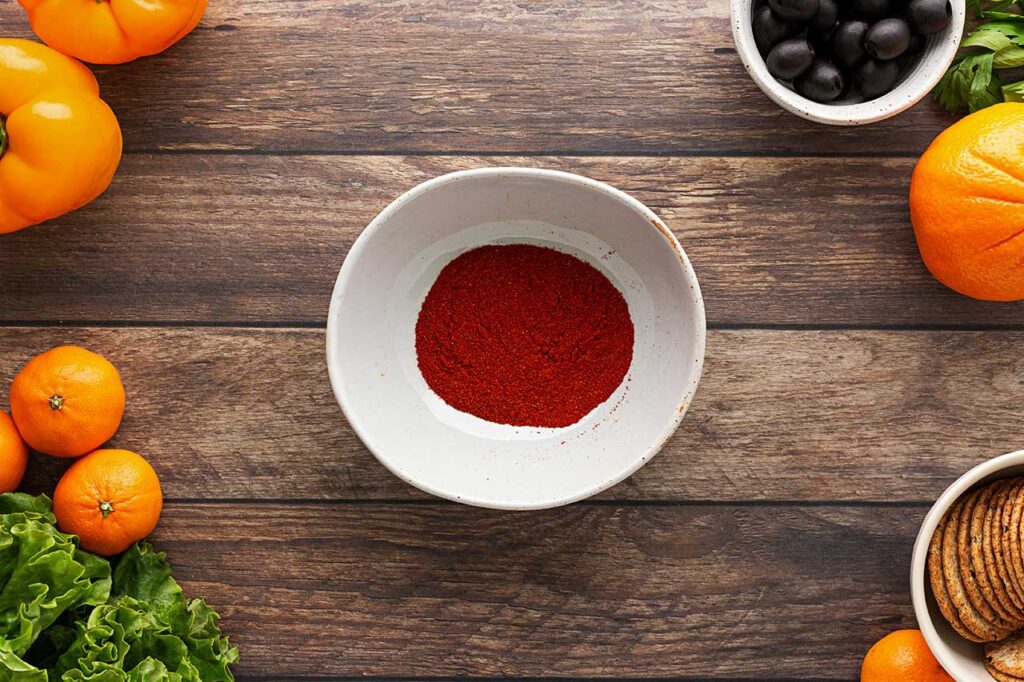 Ground paprika in a bowl.