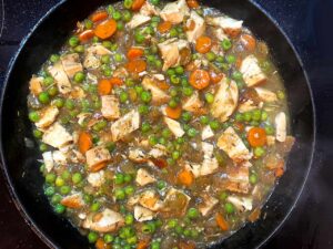 The finished filling in a skillet. If you wish, you can stir in a small amount of yogurt or cream cheese now, if you prefer a white sauce.