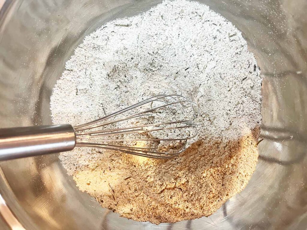 Dried herbs whisked into the dry ingredients for the oat flour topping.