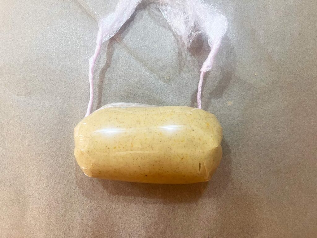 Compound Butter wrapped tightly in plastic wrap, forming a perfect log.