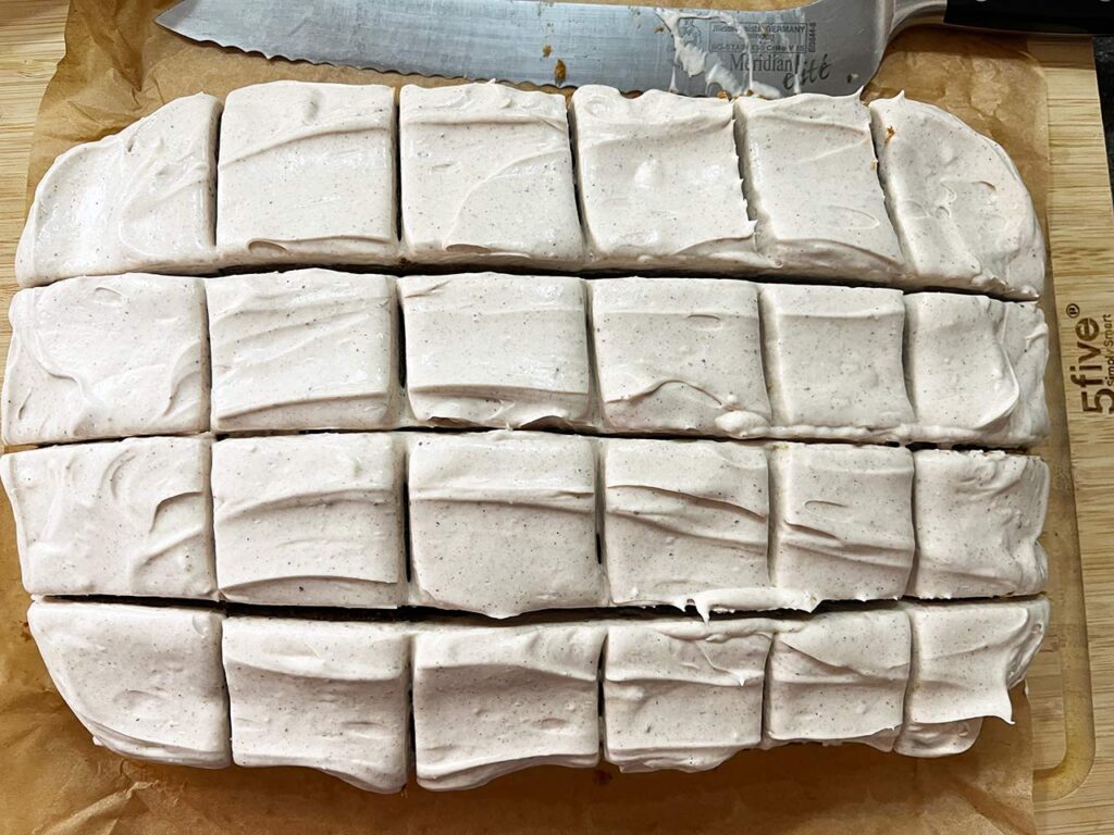 The pumpkin bar loaf with frosting, cut into 24 pieces.