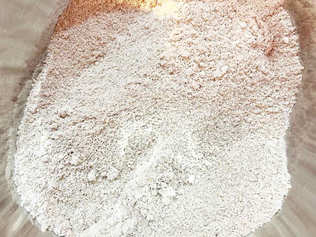 Pumpkin bar dry ingredients in a mixing bowl.
