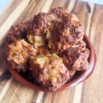 Angled front view of a brown plate piled high with Smokey Pumpkin Turkey Meatballs.