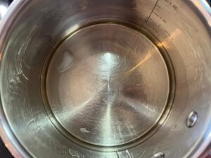 Coconut oil melting in a pot.
