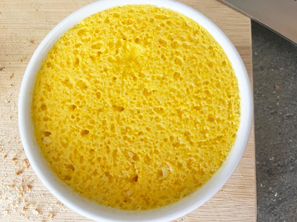 Chilled vegan butter with additions at the surface, creating a surface on the butter that isn't smooth.