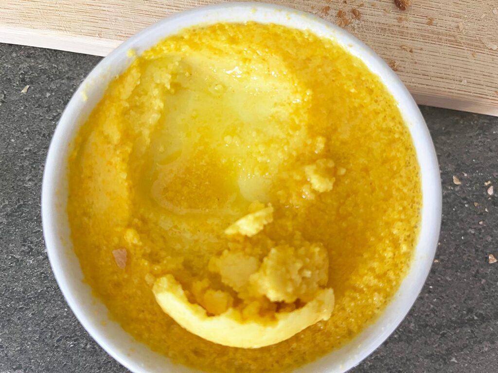 Some butter scraped away to show under the layer at the top.