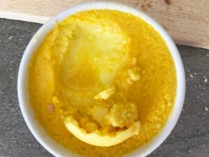 Some butter scraped away to show under the layer at the top.