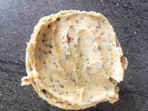 Overhead view of a bowl filled with Cowboy Butter.