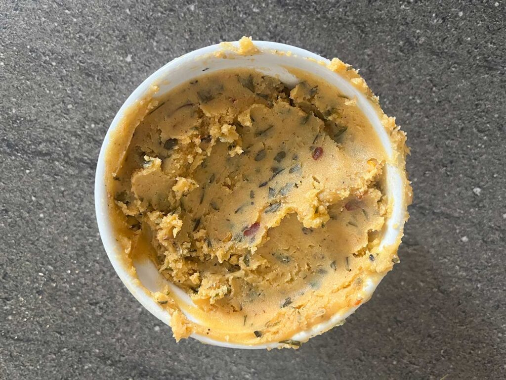 Cooled cowboy butter in a white ramekin.