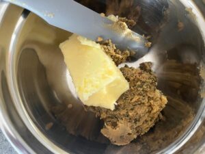 Adding in a second stick of softened butter to cowboy butter.