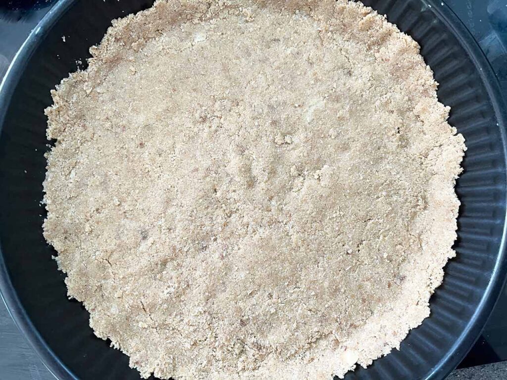 Custard Pie crust dough pressed into the bottom of a pie pan.