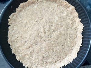 Custard Pie crust dough pressed into the bottom of a pie pan.