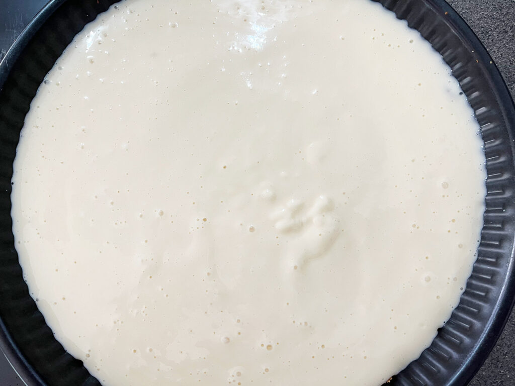 Custard Pie filling poured into crust.