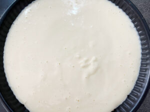 Custard Pie filling poured into crust.