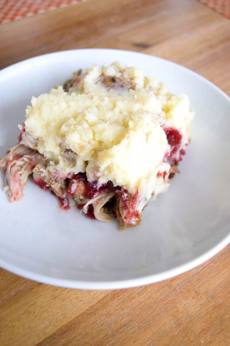 Easy Shepherd's Pie cut and served on a white plate.