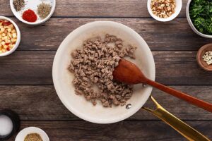 Ground turkey cooking in a skillet.