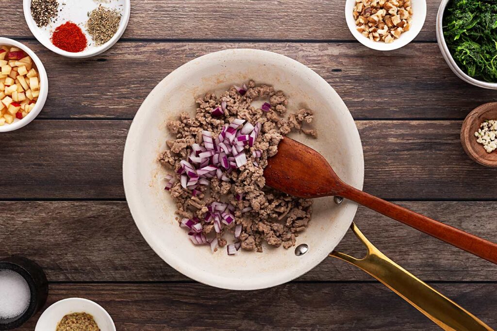 Onions added to the ground turkey.