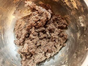 Oat Flour Chocolate Crinkle Cookie dough mixed together in a mixing bowl.