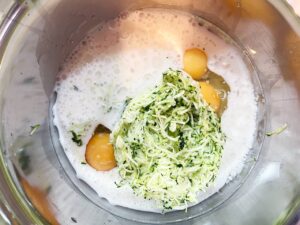 Wet ingredients for Chocolate Zucchini Bread in a mixing bowl.