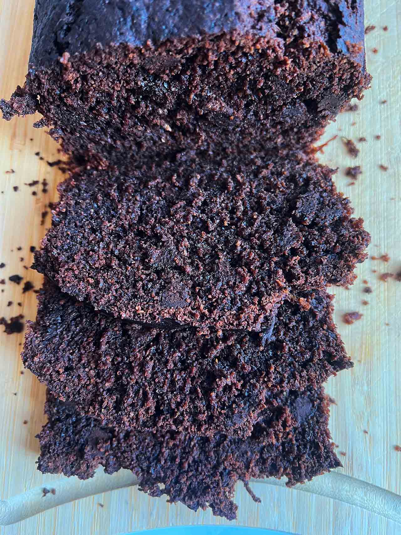 Overhead view of a partially sliced loaf of Chocolate Zucchini Bread.