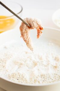 A shrimp dipped in flour mix.