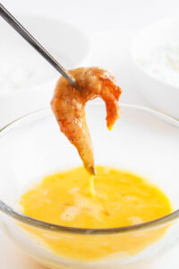 A shrimp dipped in egg wash.