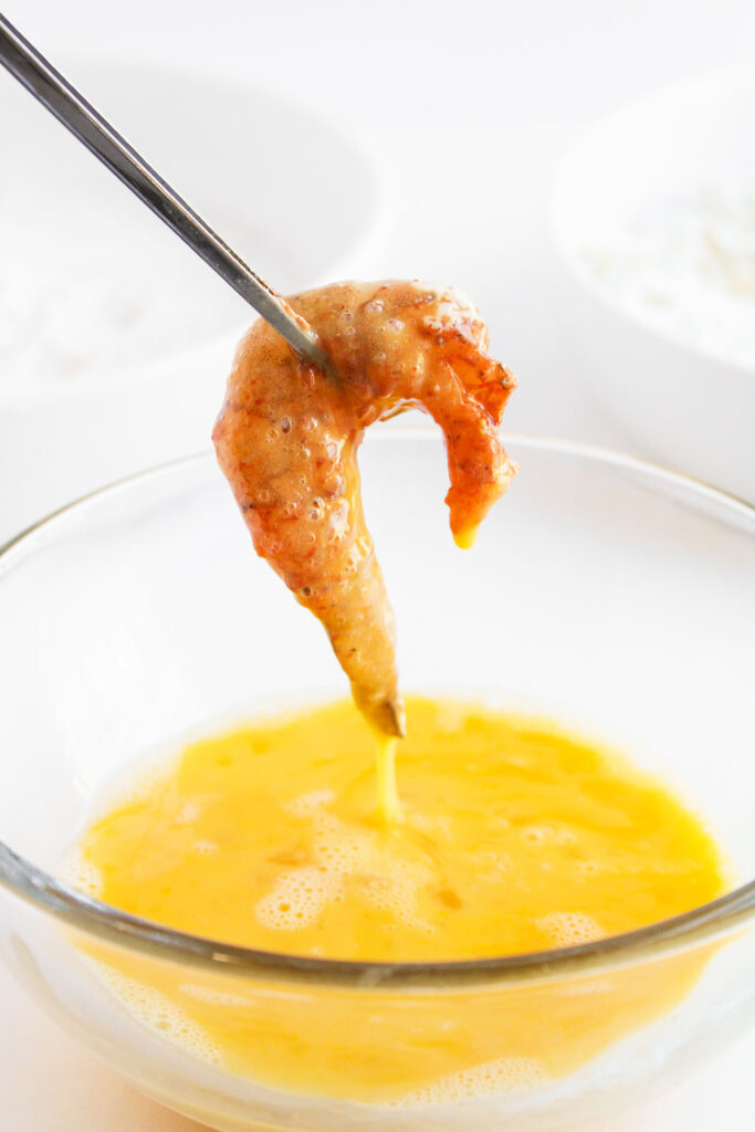 A shrimp dipped in egg wash.