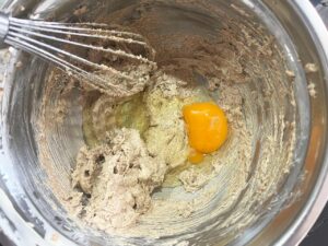 An egg added to the butter and sugar.