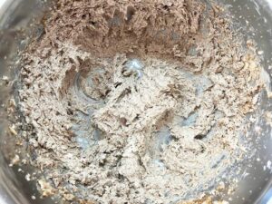 Butter and sugar whisked together in a mixing bowl.