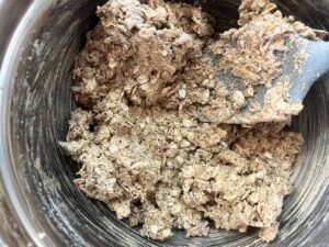 Oat Flour Oatmeal Raisin Cookie dough mixed together in a mixing bowl.