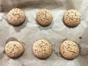 Baked Oat Flour Sugar Cookies on a parchment-lined pan.
