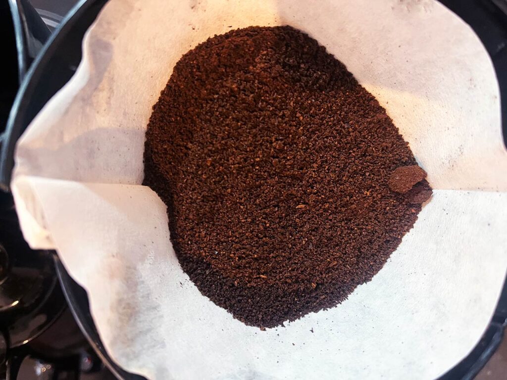 Coffee grounds in a paper filter.