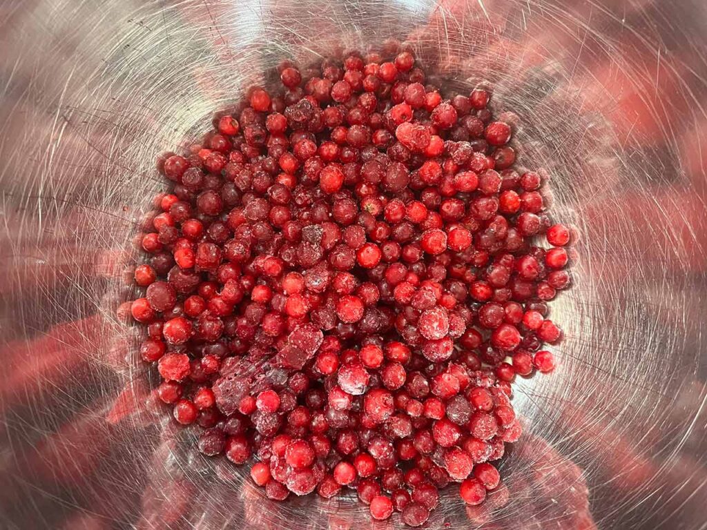 Frozen cranberries in a bowl.