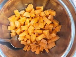 Cut sweet potato in a mixing bowl, tossed with oil, salt, and pepper.