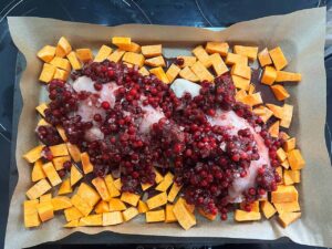 Cranberry mix spooned over the top of the chicken and sweet potatoes.