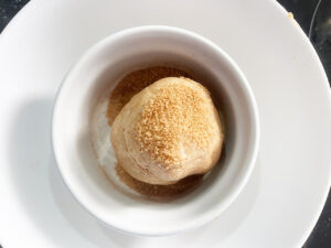 Snickerdoodle dough ball rolled in cinnamon sugar mix.