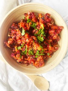 Sweet Potato Cranberry Salad in a wood bowl. Overhead focus.