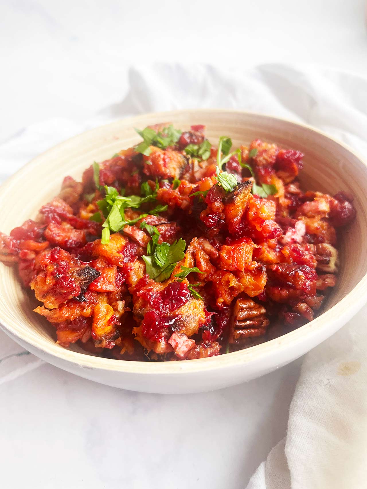 Sweet Potato Cranberry Salad in a wood bowl. Front focus.