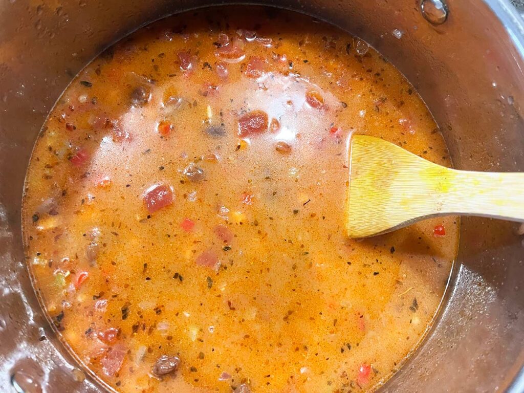 The finished Mexican Pinto Bean Soup in a soup pot.