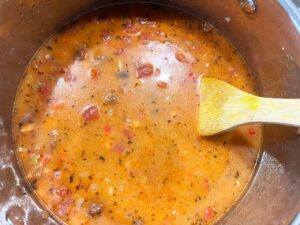 The finished Mexican Pinto Bean Soup in a soup pot.