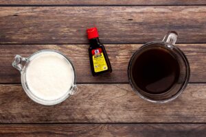 Peppermint Latte Recipe ingredients on a wood surface.
