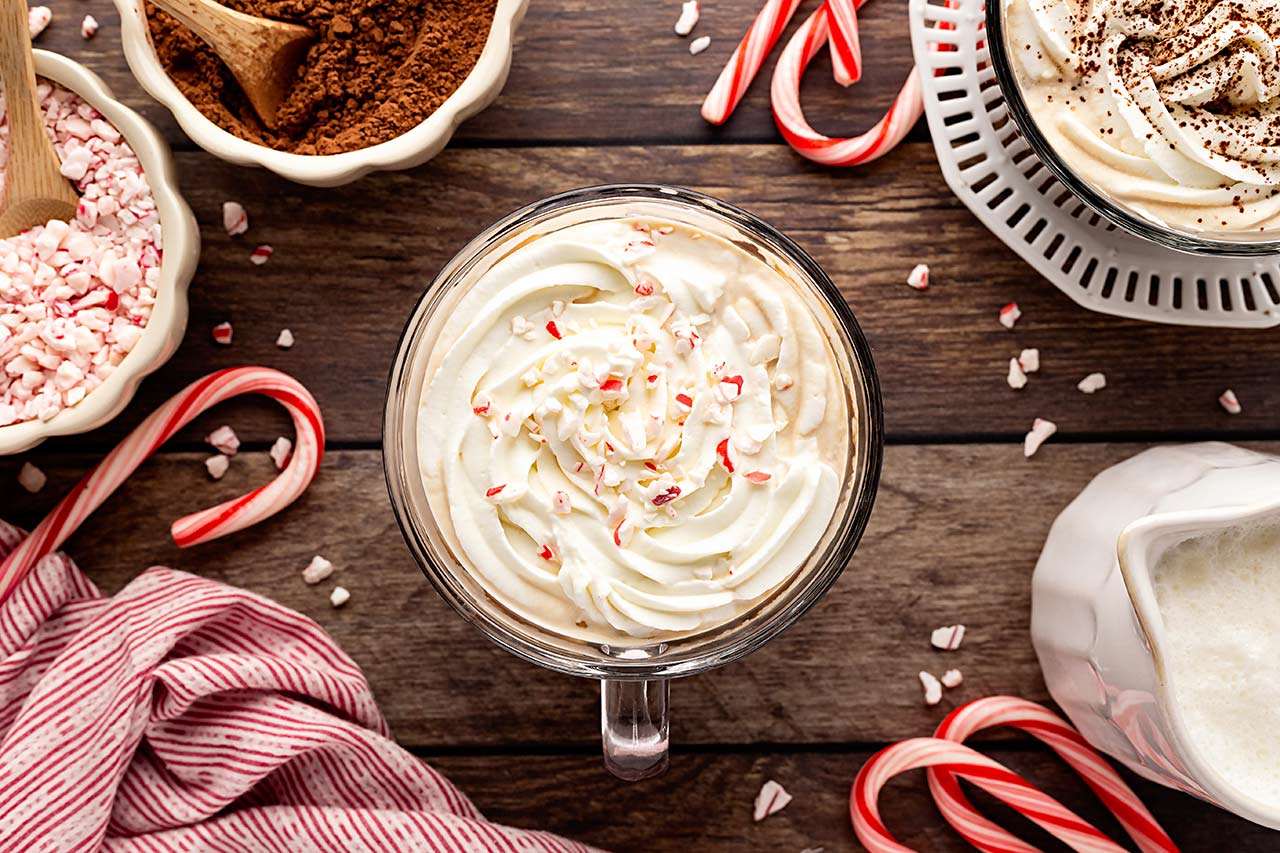 Whipped cream and crushed candy canes topping a Peppermint Latte. Overhead focus.