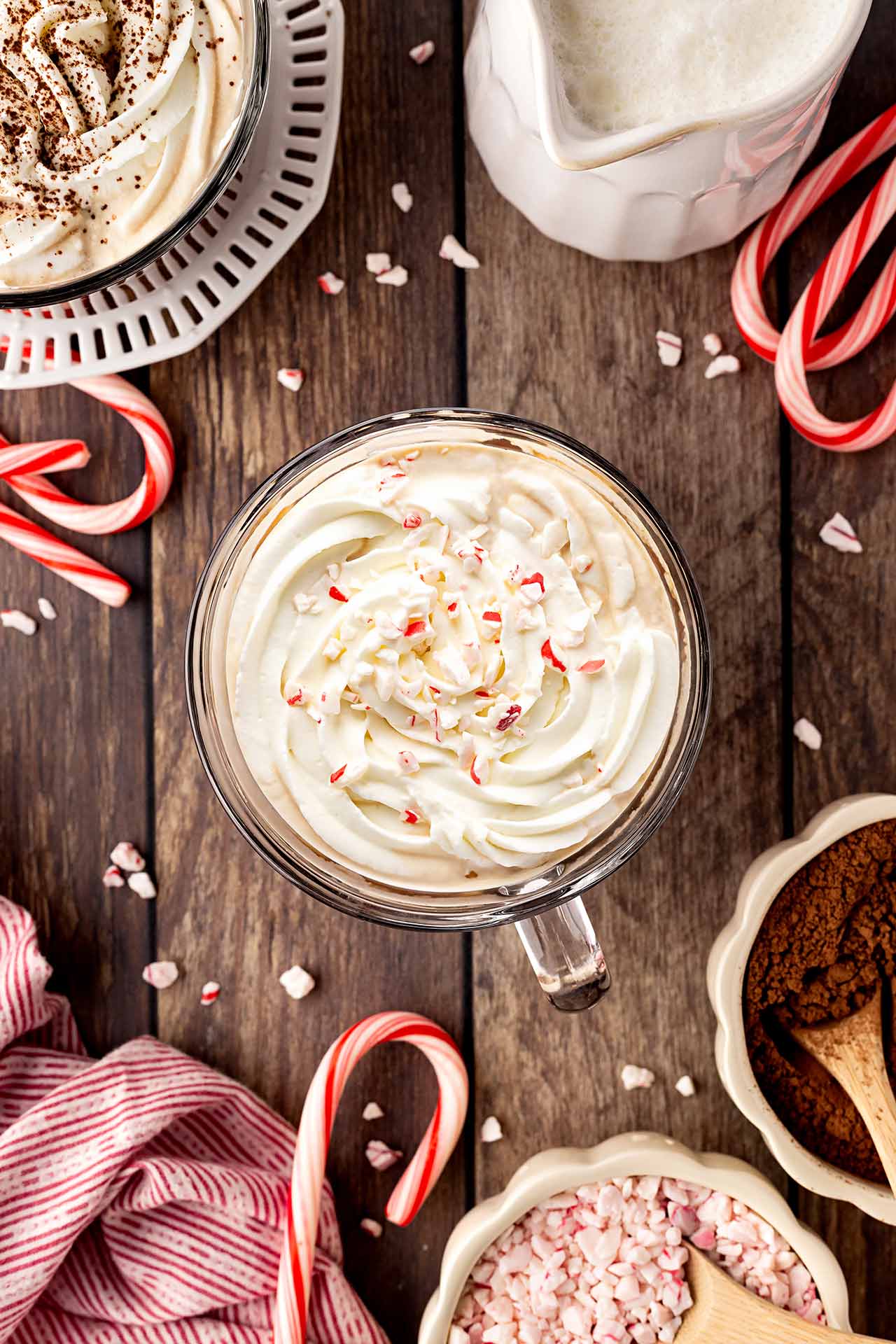 Overhead focus. A Peppermint Latte topped with whipped cream and crushed candy cane.
