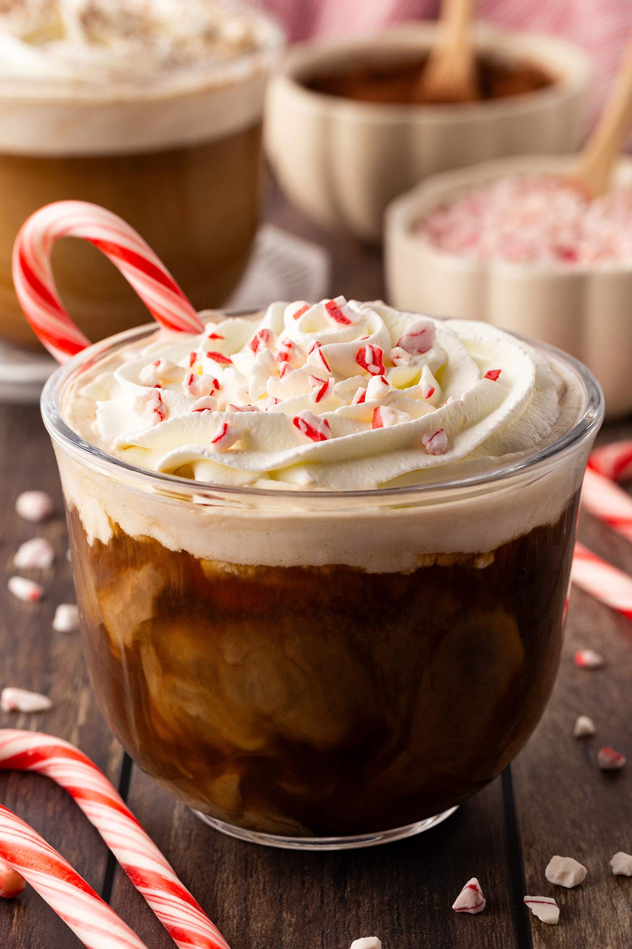 Front, center focus. A Peppermint Latte in a glass mug.