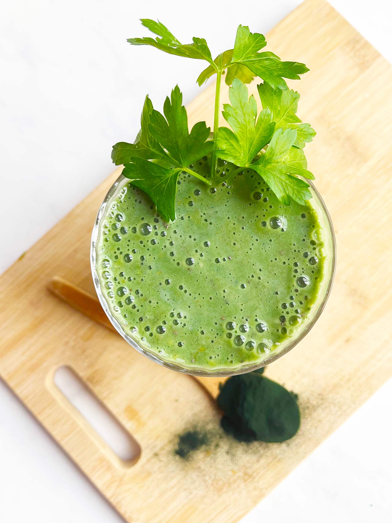 Overhead focus. A full glass of Spirulina Smoothie.