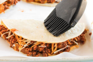 Basting the tortillas.