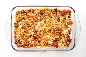 Beef Enchilada Casserole topped with shredded cheese..