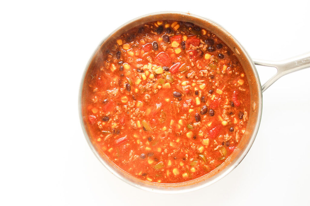 The finished Beef Enchilada Casserole filling in a skillet.